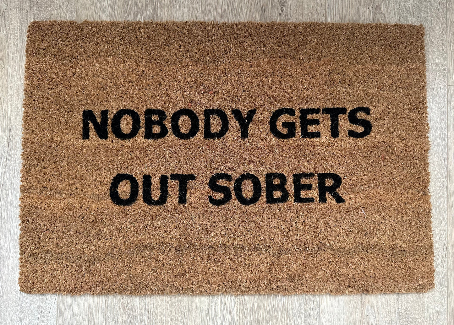 Nobody Gets Out Doormat